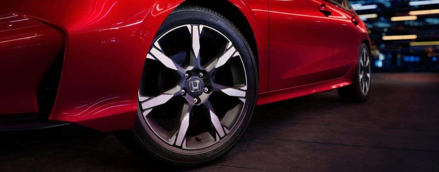 Close-up on the wheels of a red 2026 Honda Accord.