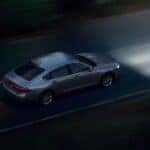 A silver 2026 Honda Accord driving at night.