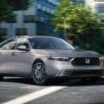 A gray 2026 Honda Accord cornering an intersection.