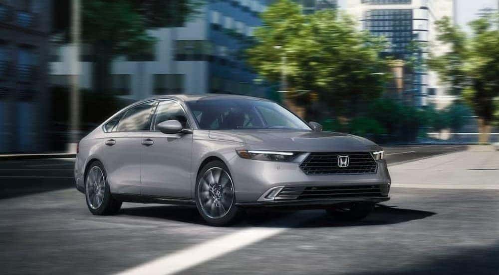A gray 2026 Honda Accord cornering an intersection.