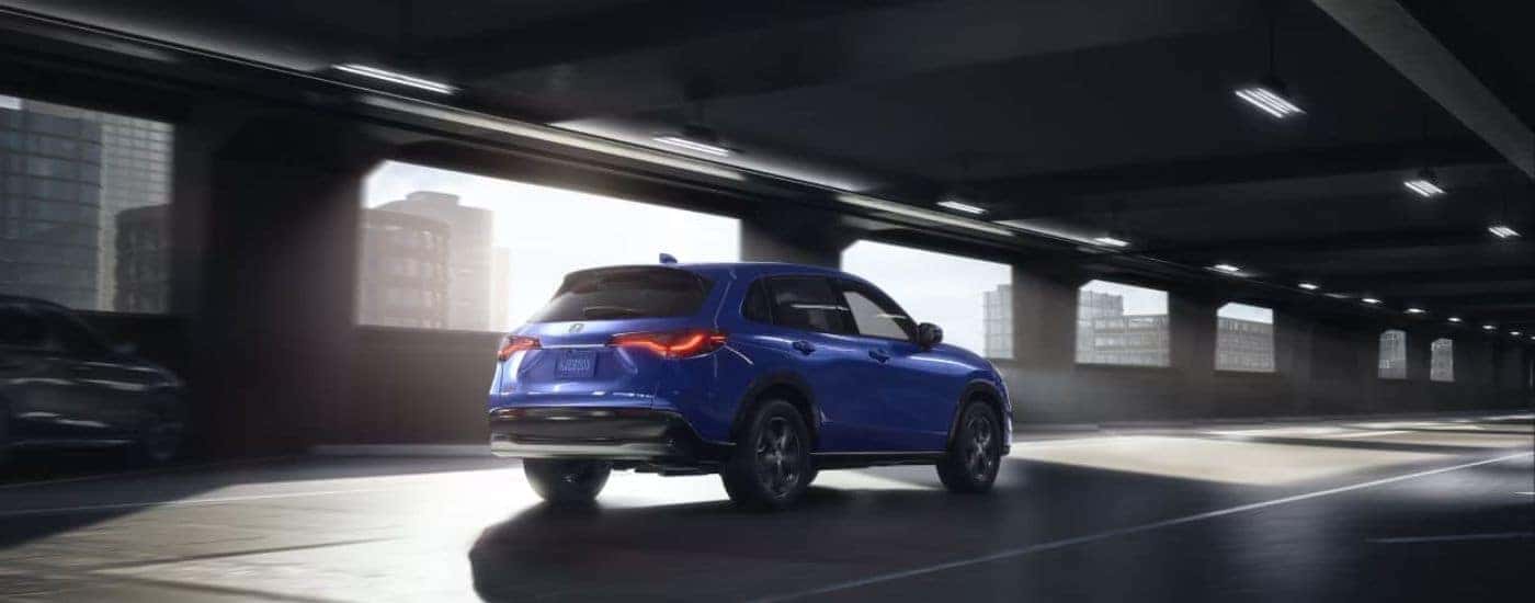 Blue 2023 Honda CR-V in a parking garage