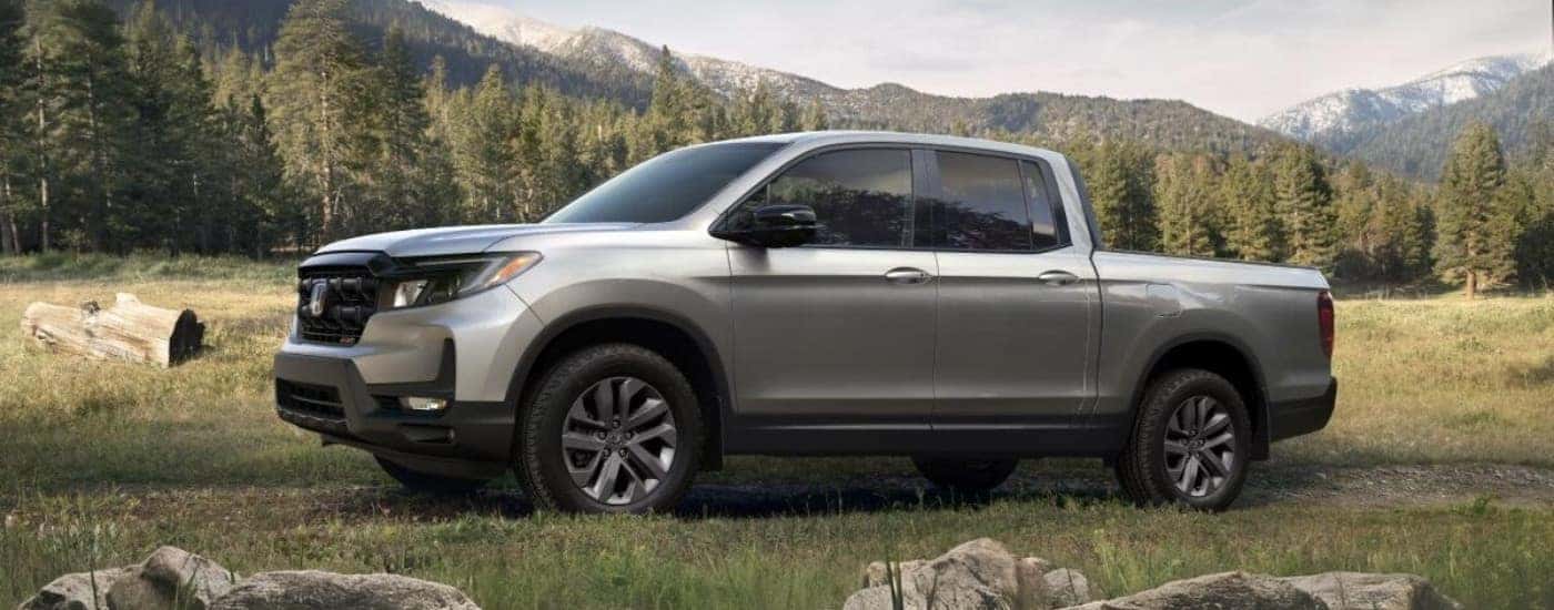 Silver 2025 Honda Ridgeline Sport parked off-road at an angle
