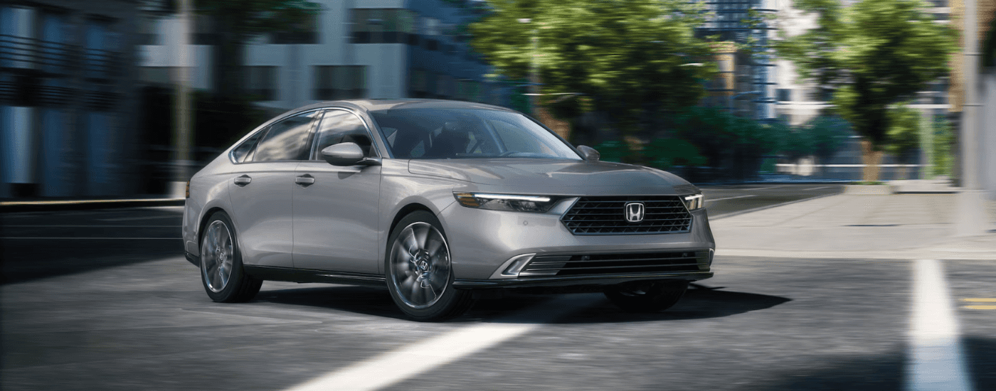 Silver 2026 Honda Accord Hybrid making a turn