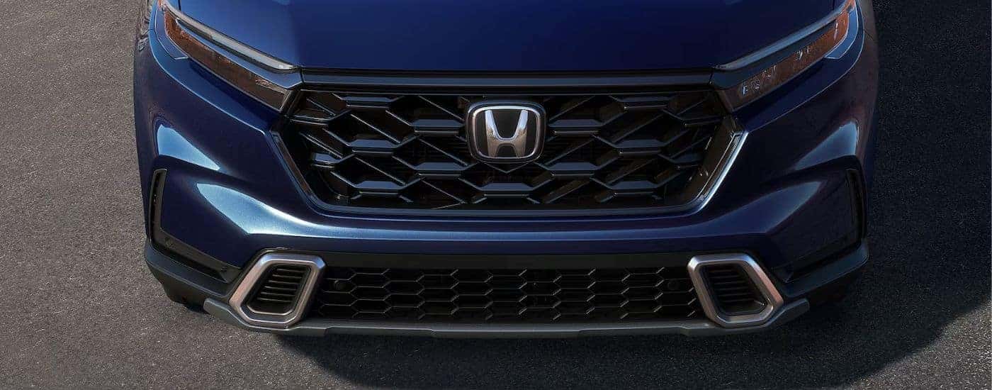 Close up of the grill on a blue 2026 Honda CR-V Hybrid