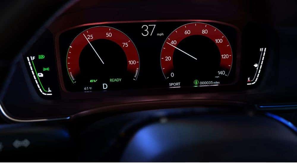 Digital gauge cluster of a 2026 Honda Civic Sedan Hybrid.