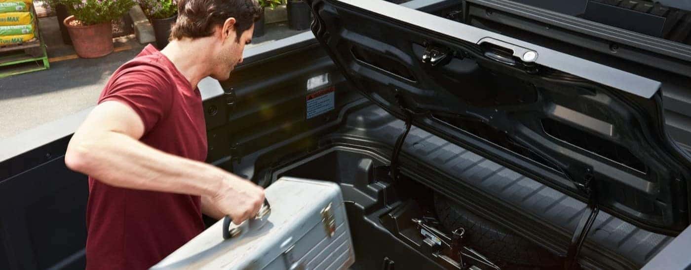 Under-bed storage in a black 2026 Honda Ridgeline TrailSport.
