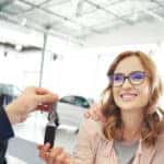 couple closing deal at dealership