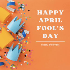 "happy April fool's day Subaru of Albany" on top of a photograph of crowns and confetti.