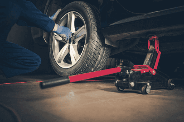 Repairing A Car With A Spanner, Unscrew The Nut Firmly. Stock