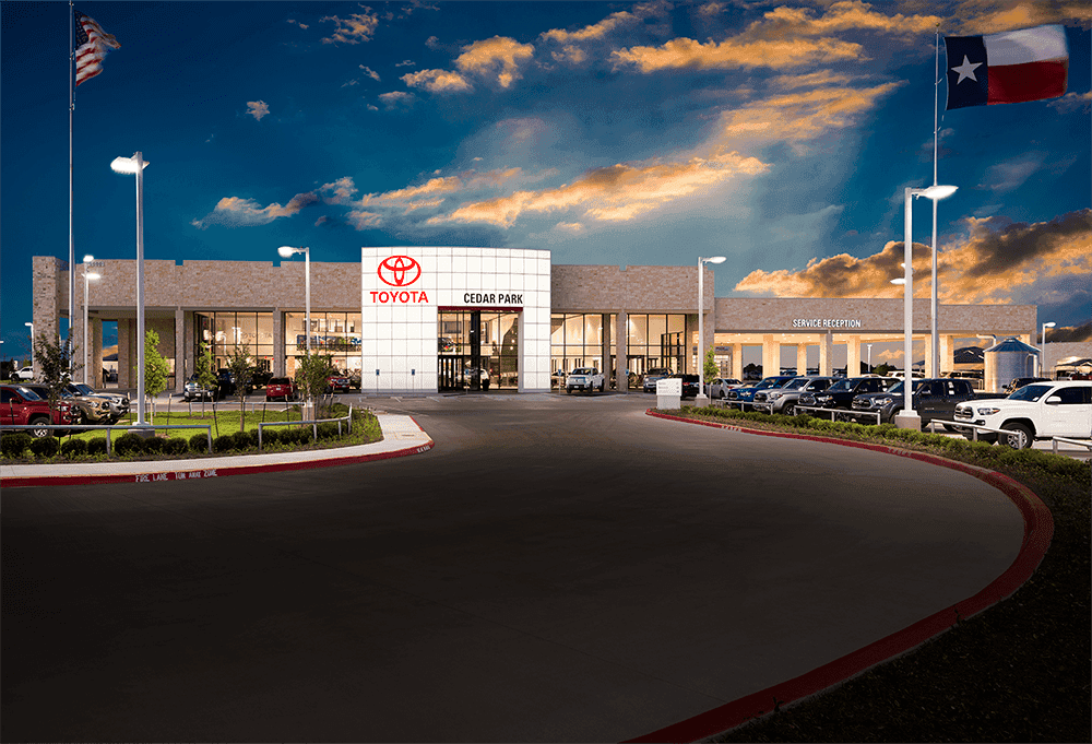 sales women greeting guest on showroom floor at a toyota dealership 