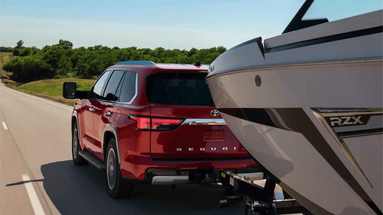 Red 2026 Toyota Sequoia towing boat Near Austin, TX
