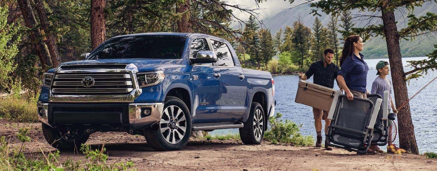 Blue 2021 Toyota Tundra parked by a lake