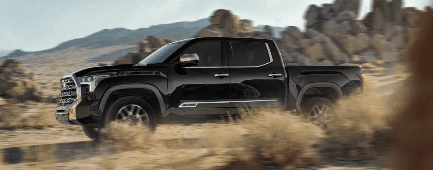 Black 2026 Toyota Tundra Limited driving through a desert