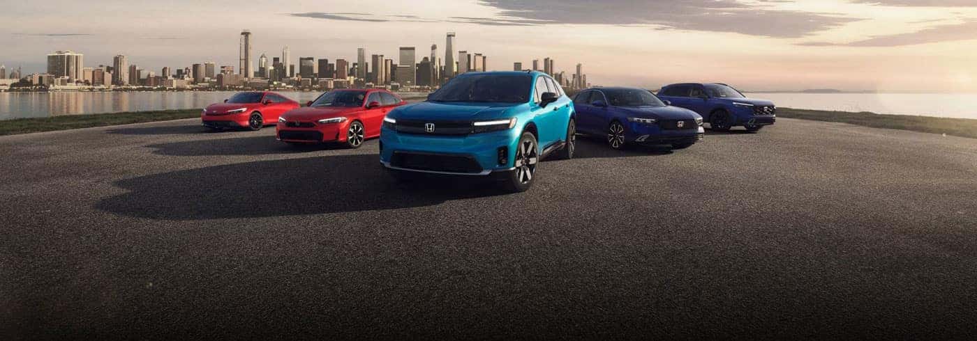 2026 Honda Electrification lineup parked with the city far in the background, showing Prelude, Civic Sedan, Prologue, Accord and CR-V.