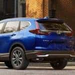 Honda CR-V Parked on Side of Road in Front of Stores