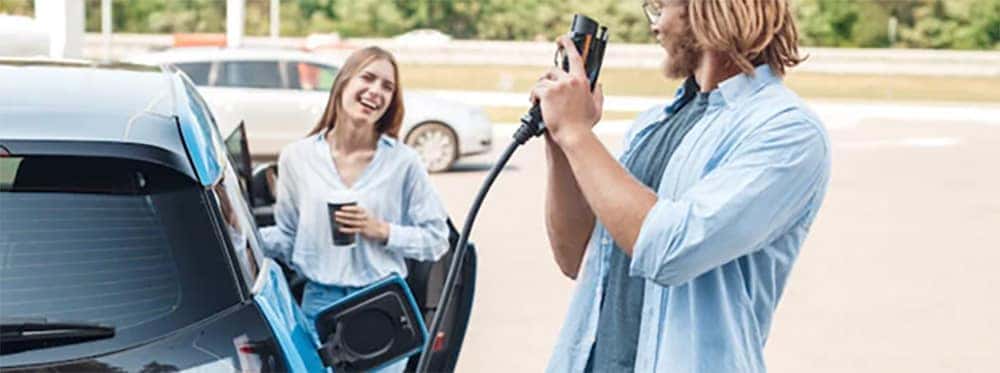 Couple getting ready to go on an EV road trip