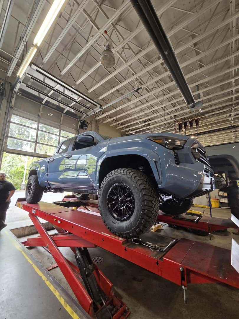 Side view of a lifted Toyota Tacoma
